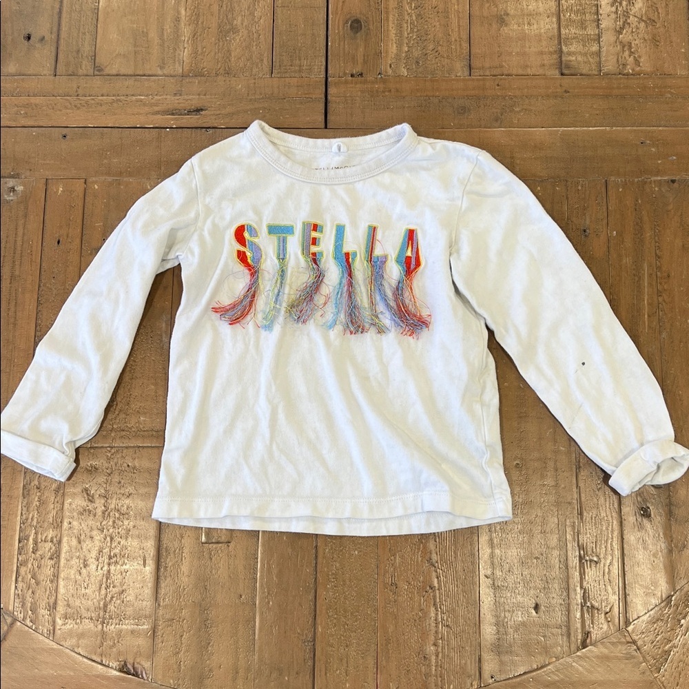 Stella McCartney Kids White Long Sleeve logo Tee with Colorful Tassels 4 years